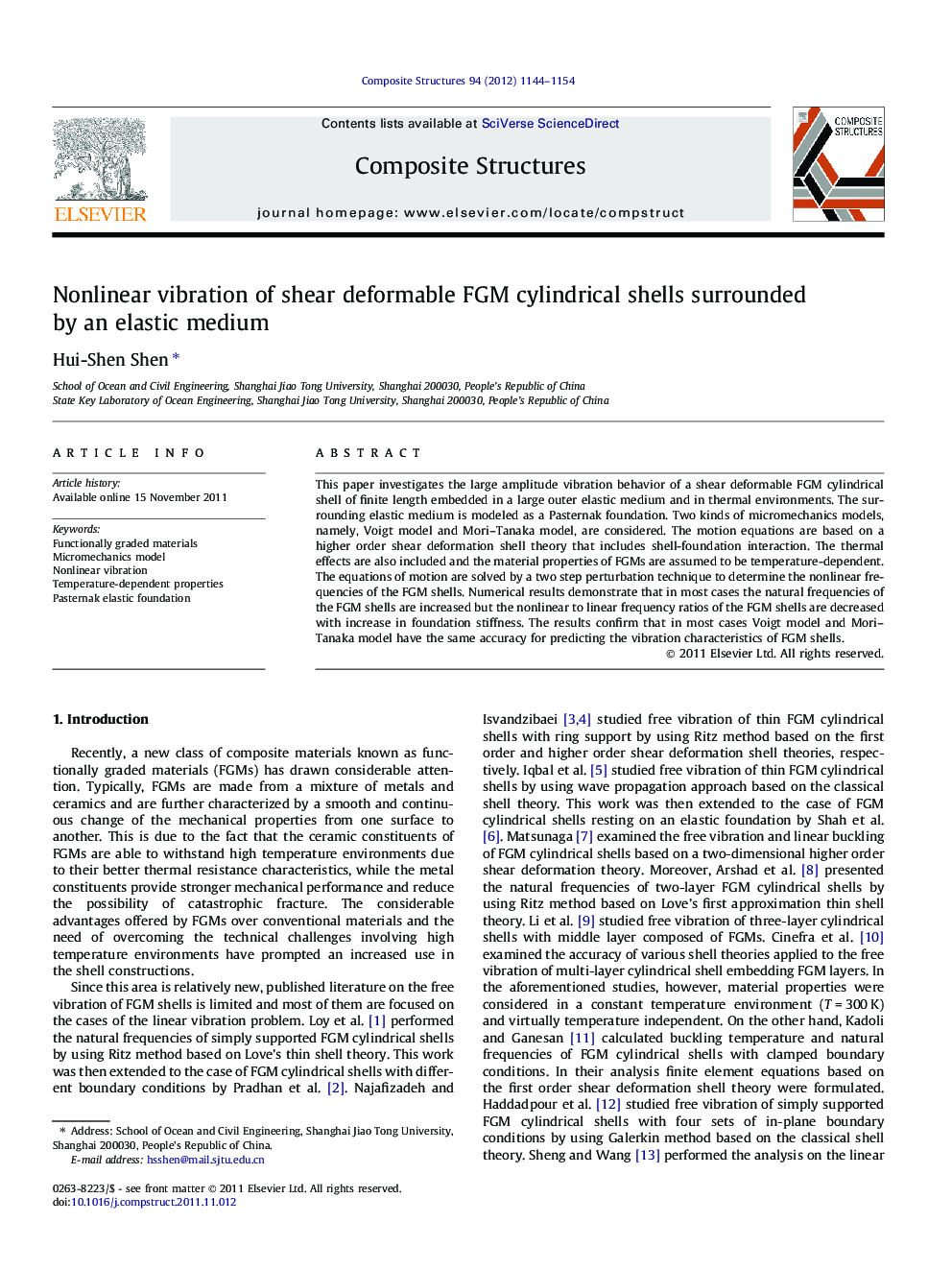 Nonlinear vibration of shear deformable FGM cylindrical shells surrounded by an elastic medium