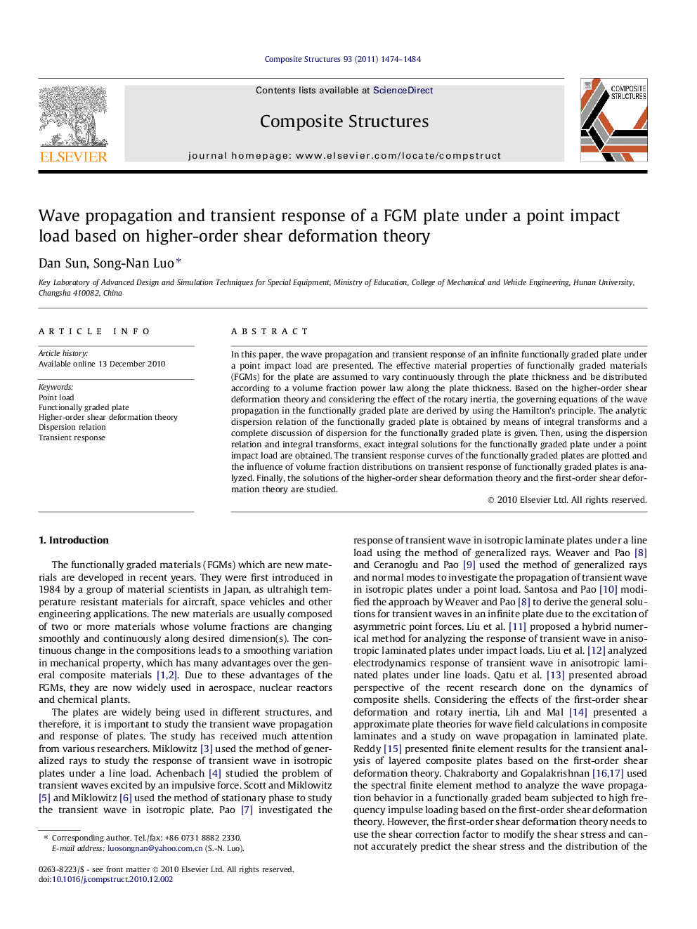 Wave propagation and transient response of a FGM plate under a point impact load based on higher-order shear deformation theory