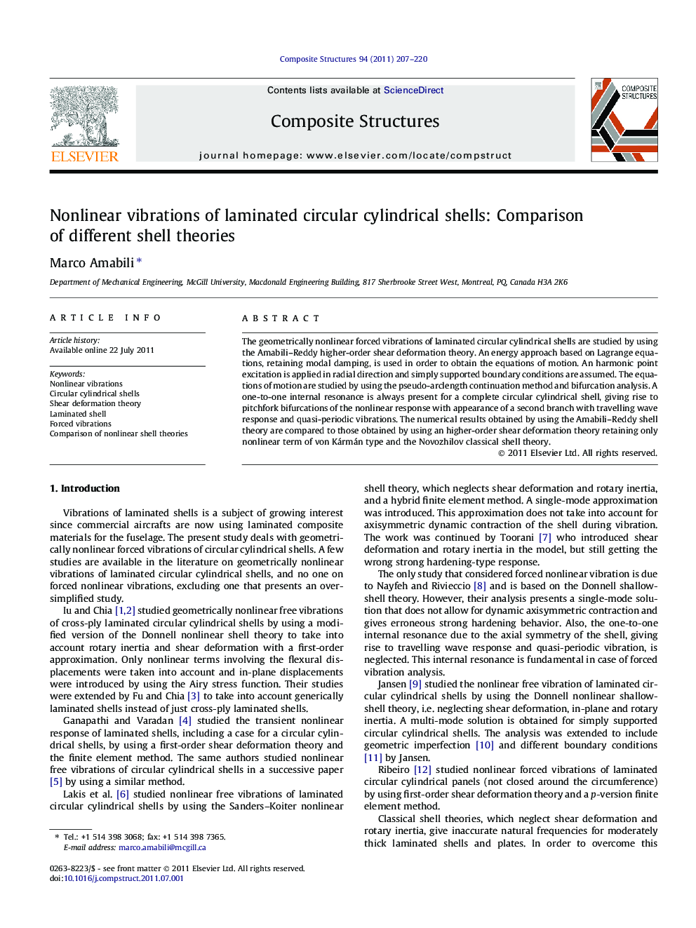 Nonlinear vibrations of laminated circular cylindrical shells: Comparison of different shell theories