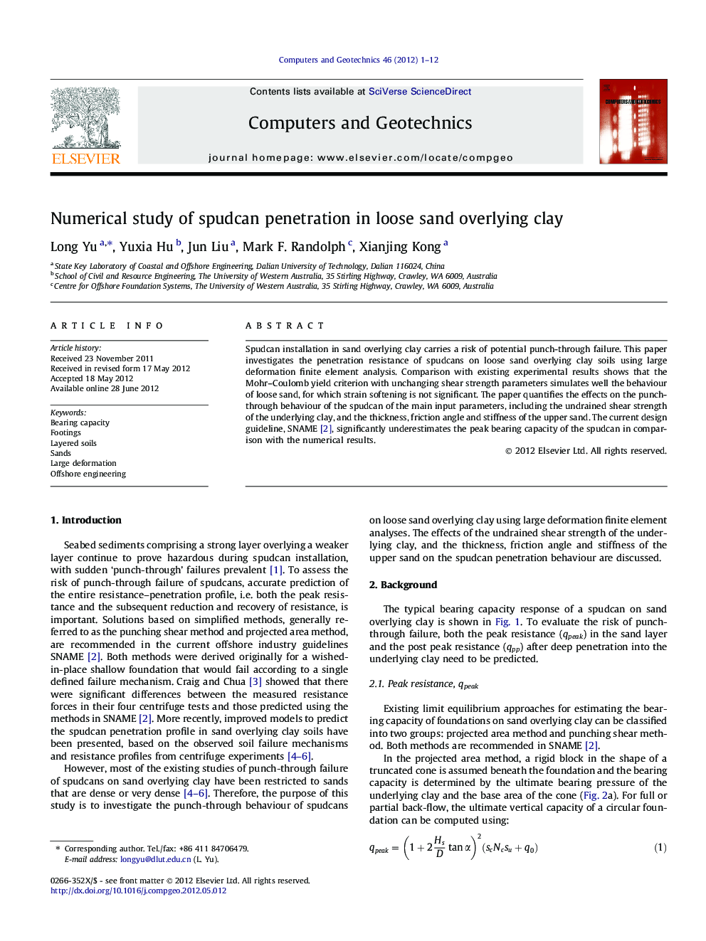 Numerical study of spudcan penetration in loose sand overlying clay