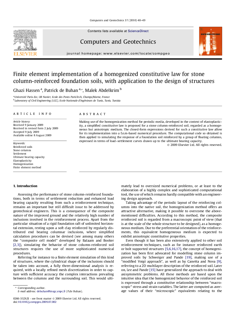 Finite element implementation of a homogenized constitutive law for stone column-reinforced foundation soils, with application to the design of structures