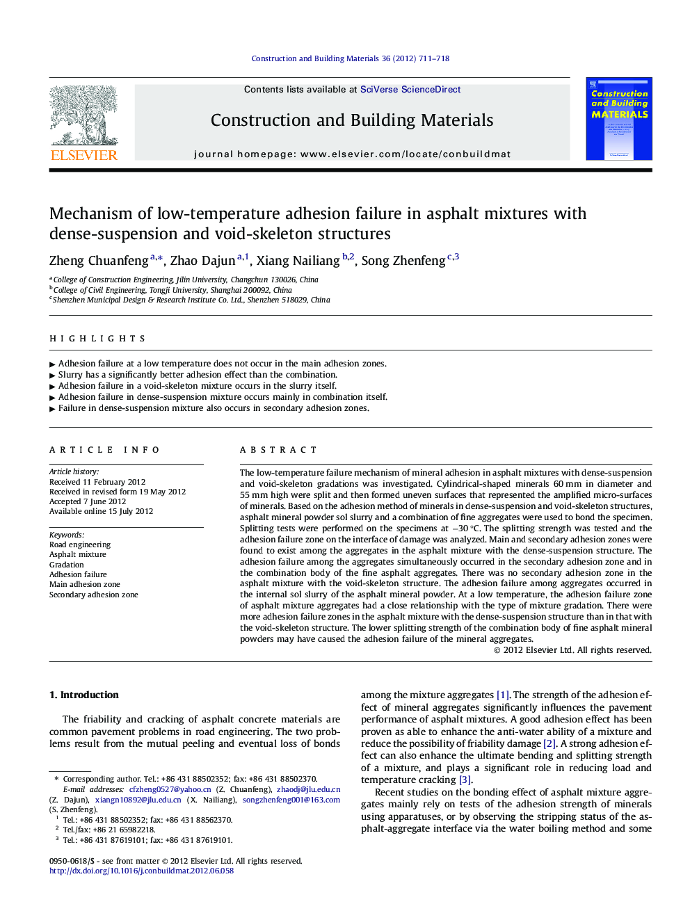 Mechanism of low-temperature adhesion failure in asphalt mixtures with dense-suspension and void-skeleton structures