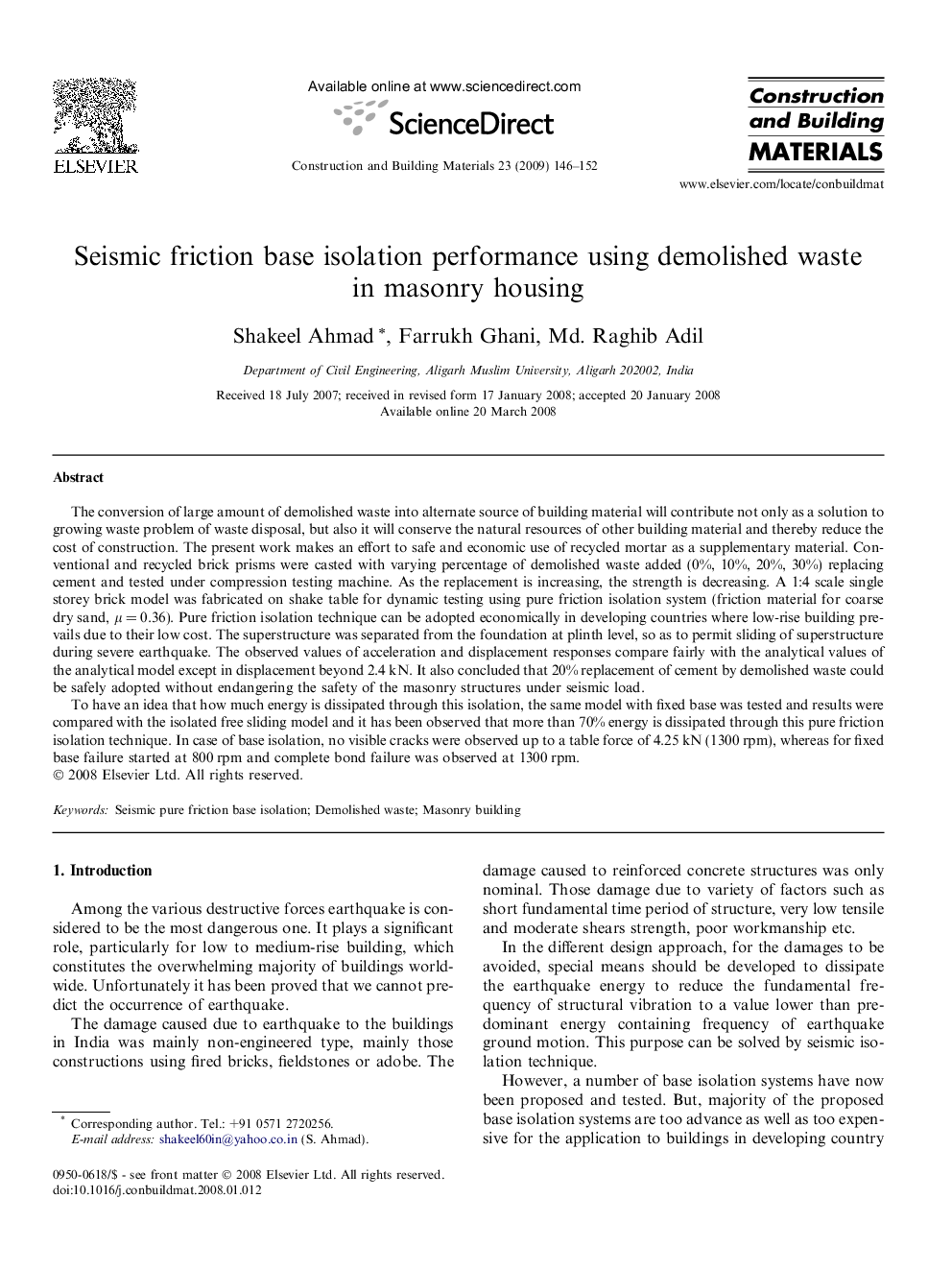 Seismic friction base isolation performance using demolished waste in masonry housing