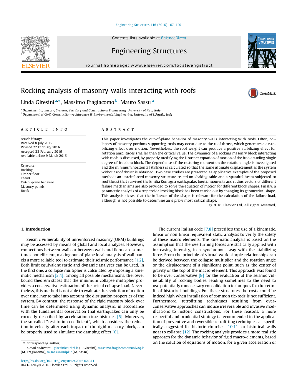 Rocking analysis of masonry walls interacting with roofs