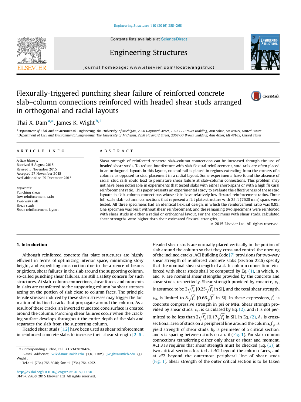 Flexurally-triggered punching shear failure of reinforced concrete slab–column connections reinforced with headed shear studs arranged in orthogonal and radial layouts