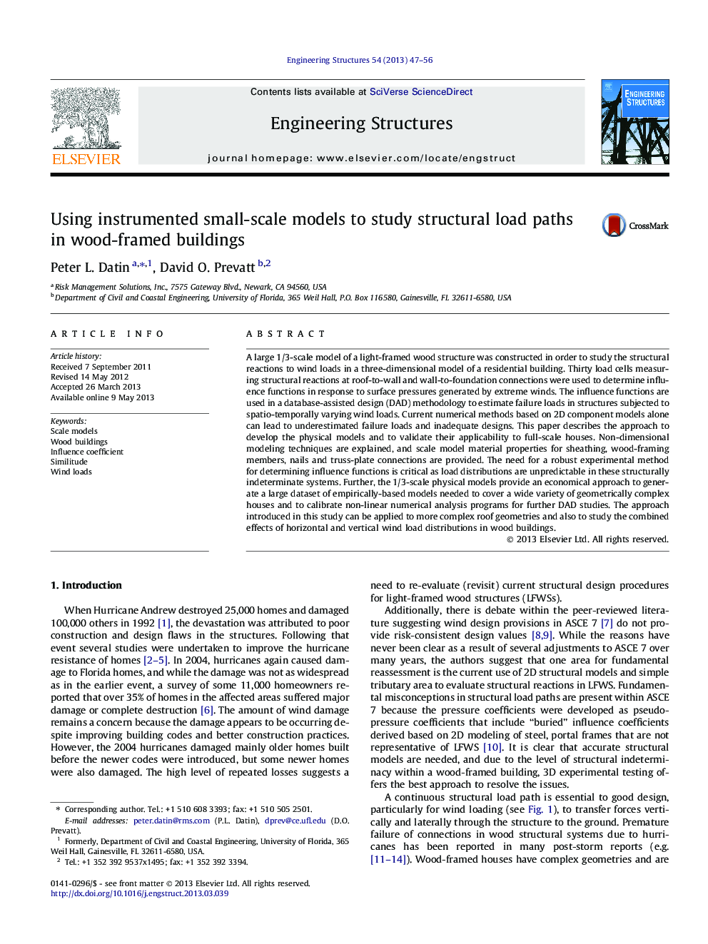 Using instrumented small-scale models to study structural load paths in wood-framed buildings