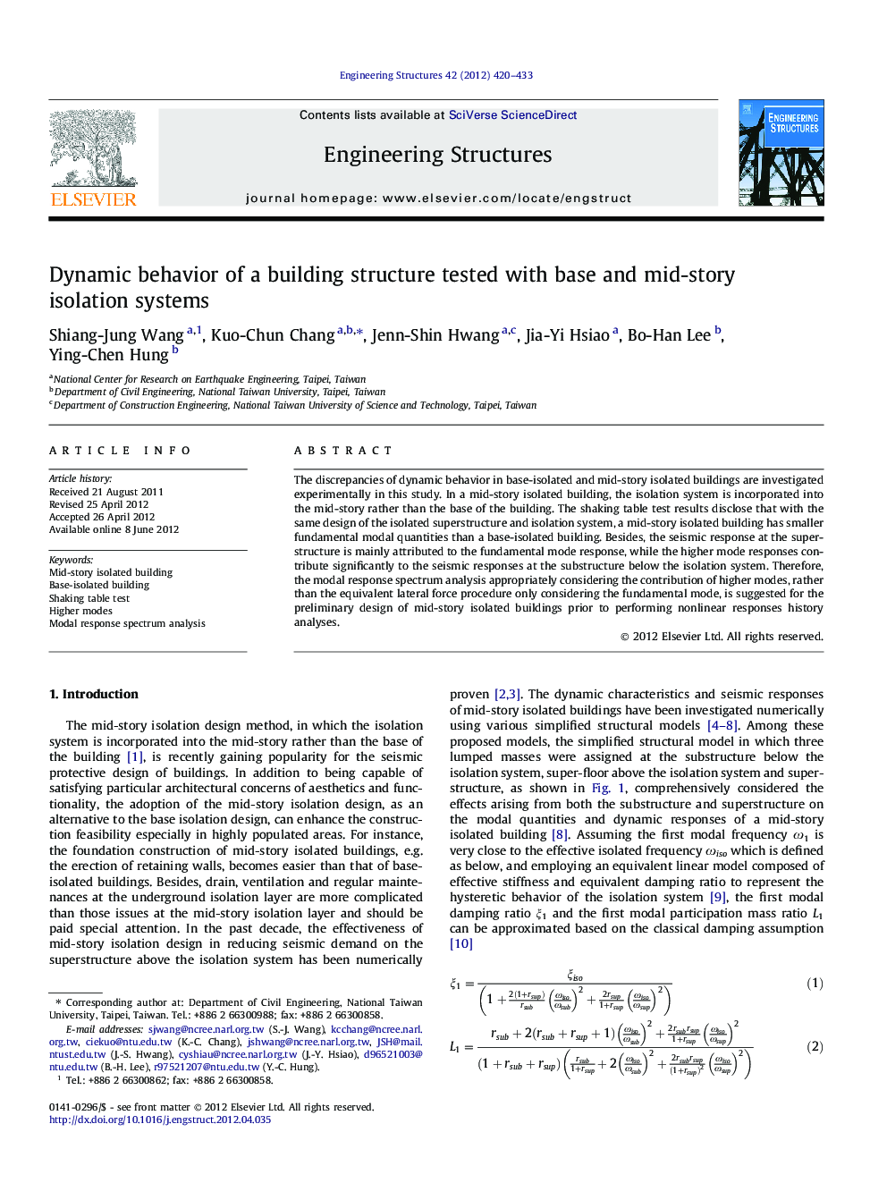 Dynamic behavior of a building structure tested with base and mid-story isolation systems