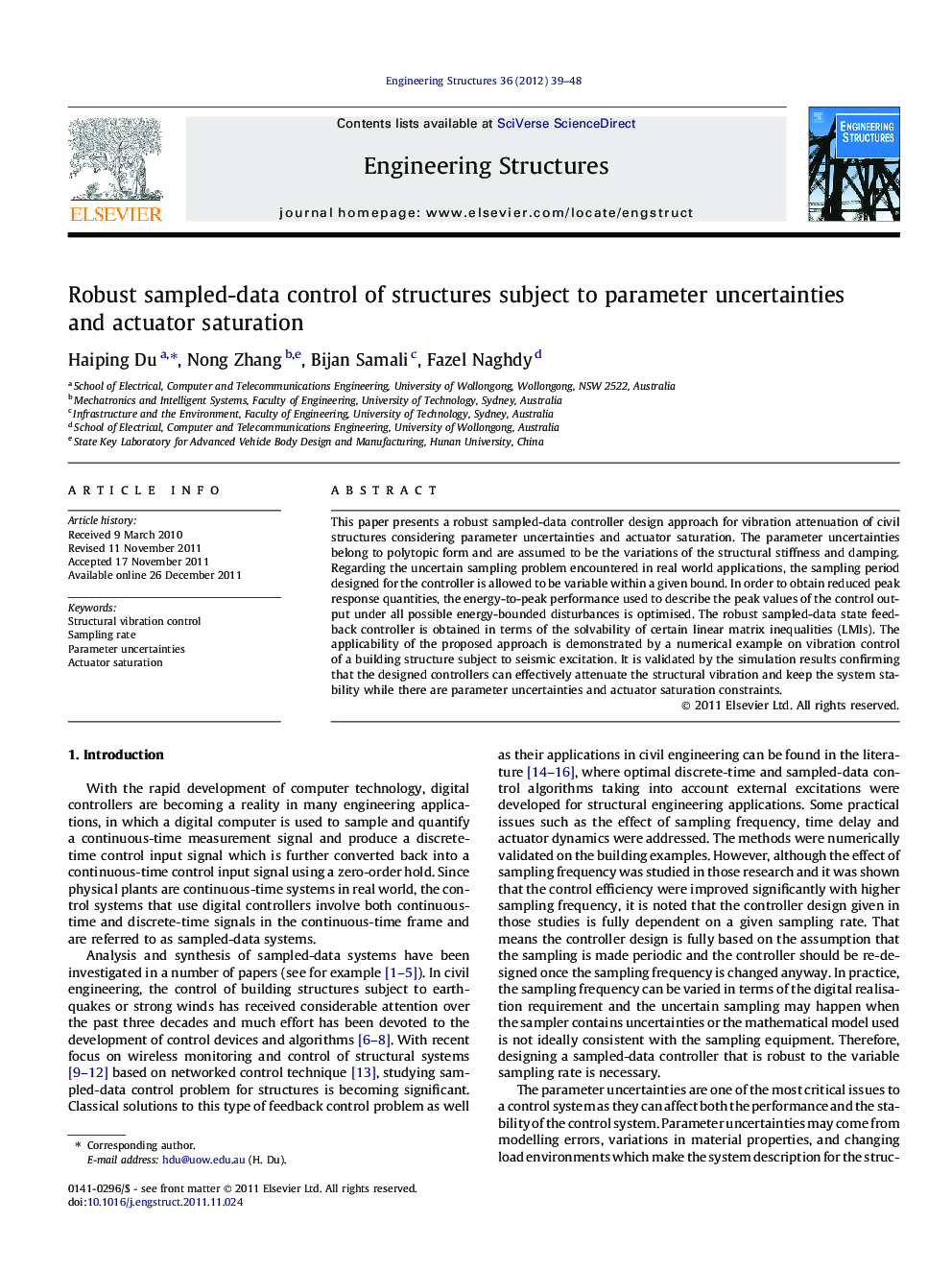 Robust sampled-data control of structures subject to parameter uncertainties and actuator saturation