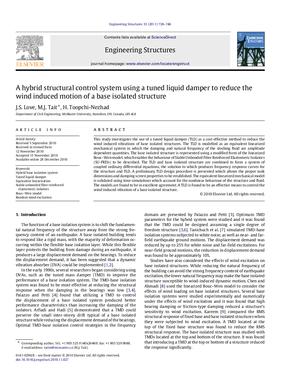 A hybrid structural control system using a tuned liquid damper to reduce the wind induced motion of a base isolated structure