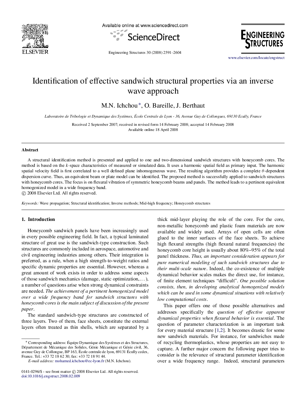 Identification of effective sandwich structural properties via an inverse wave approach