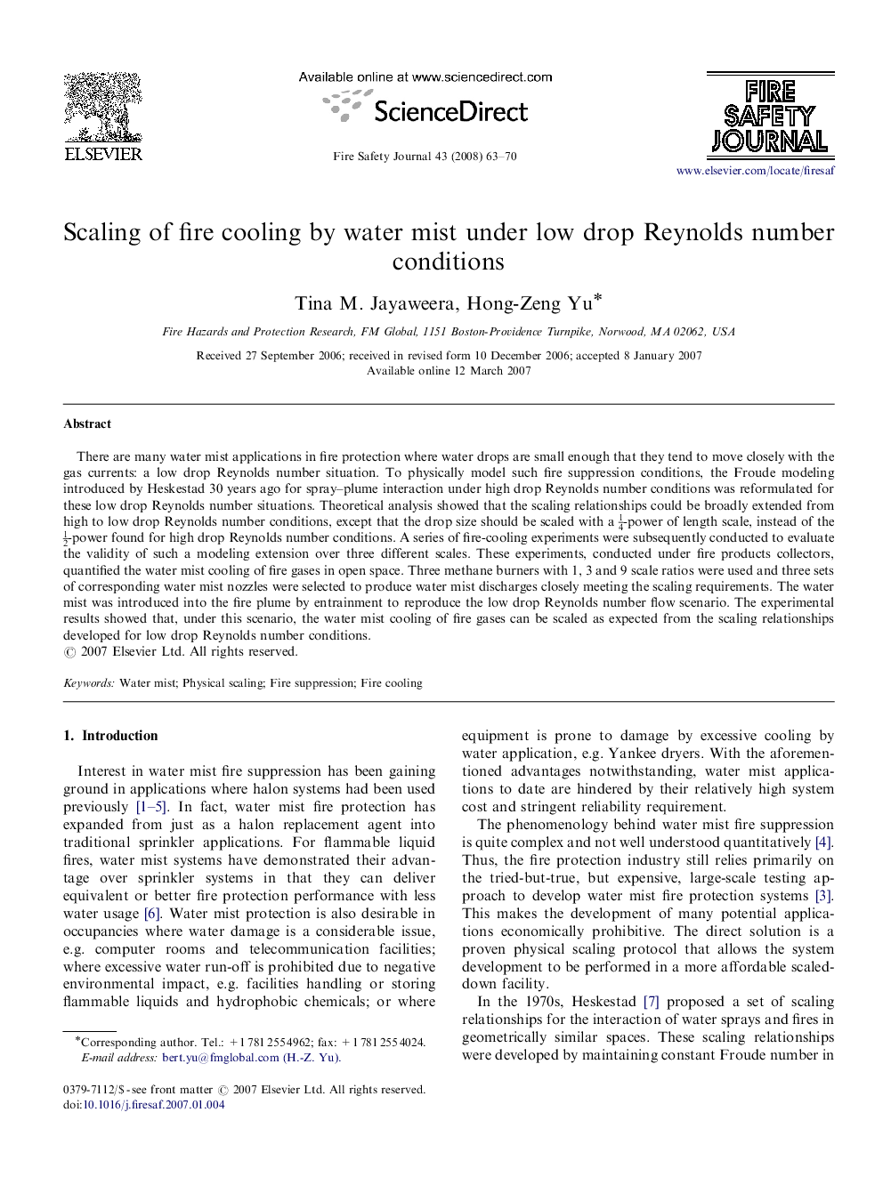 Scaling of fire cooling by water mist under low drop Reynolds number conditions