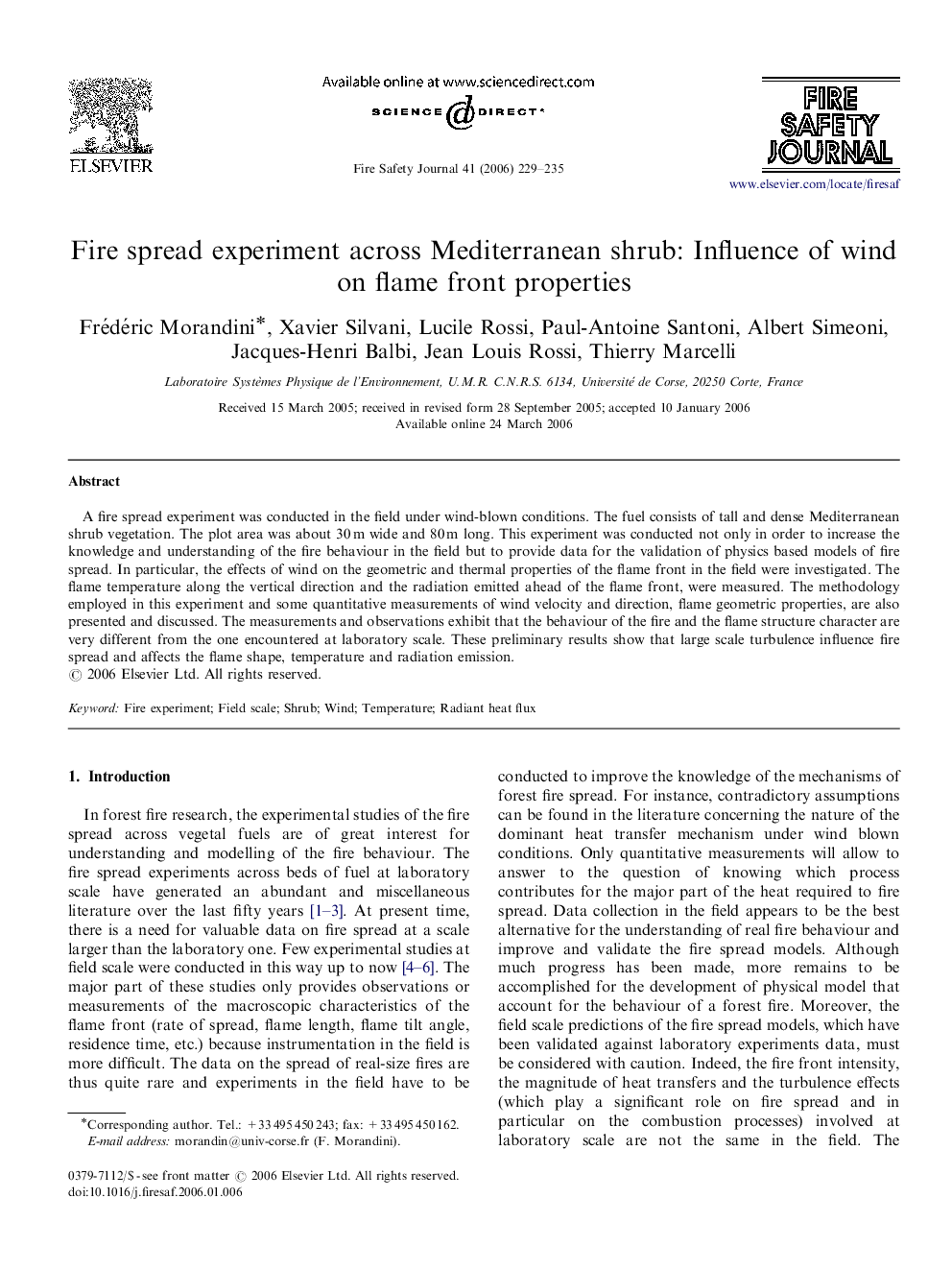 Fire spread experiment across Mediterranean shrub: Influence of wind on flame front properties