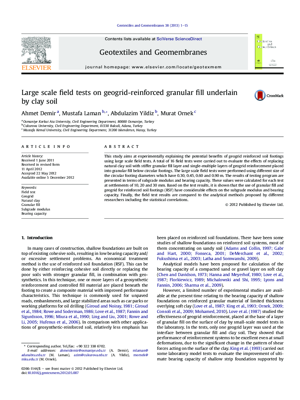 Large scale field tests on geogrid-reinforced granular fill underlain by clay soil