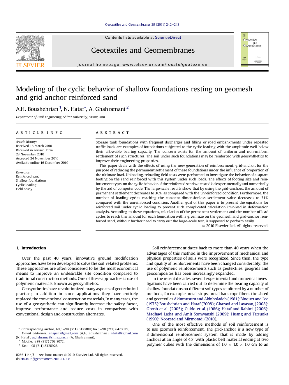 Modeling of the cyclic behavior of shallow foundations resting on geomesh and grid-anchor reinforced sand