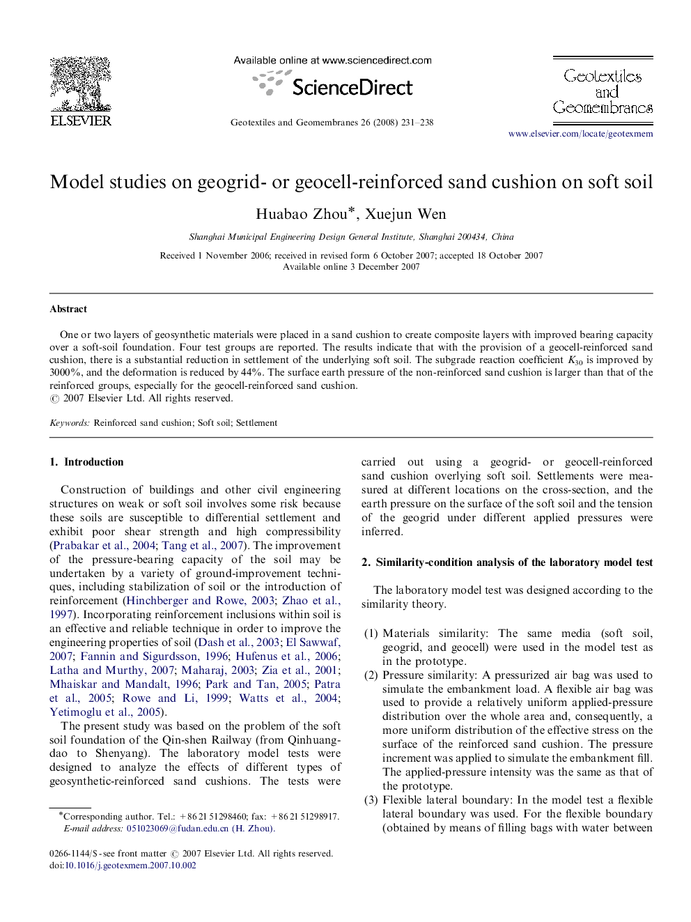 Model studies on geogrid- or geocell-reinforced sand cushion on soft soil