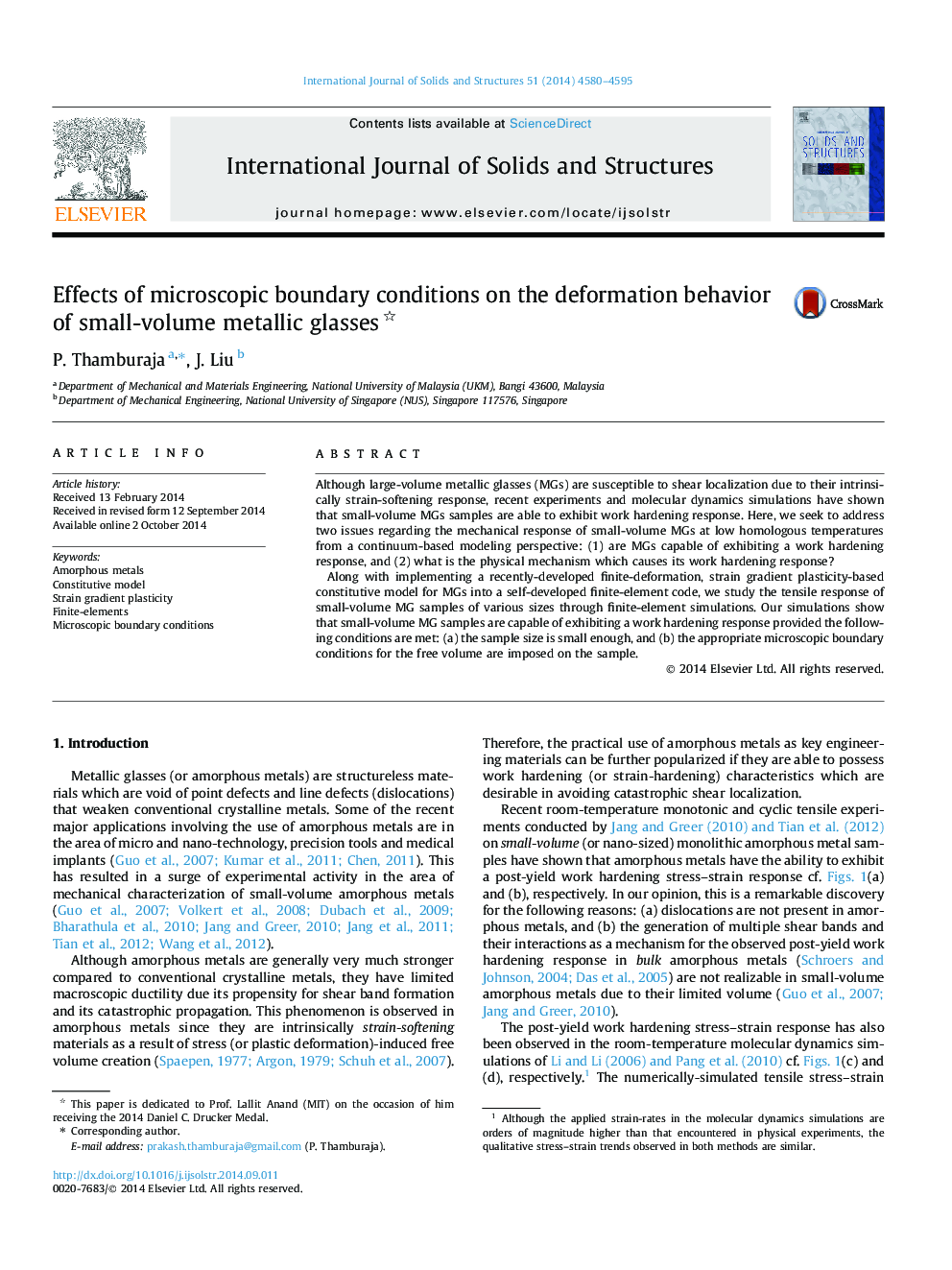 Effects of microscopic boundary conditions on the deformation behavior of small-volume metallic glasses 