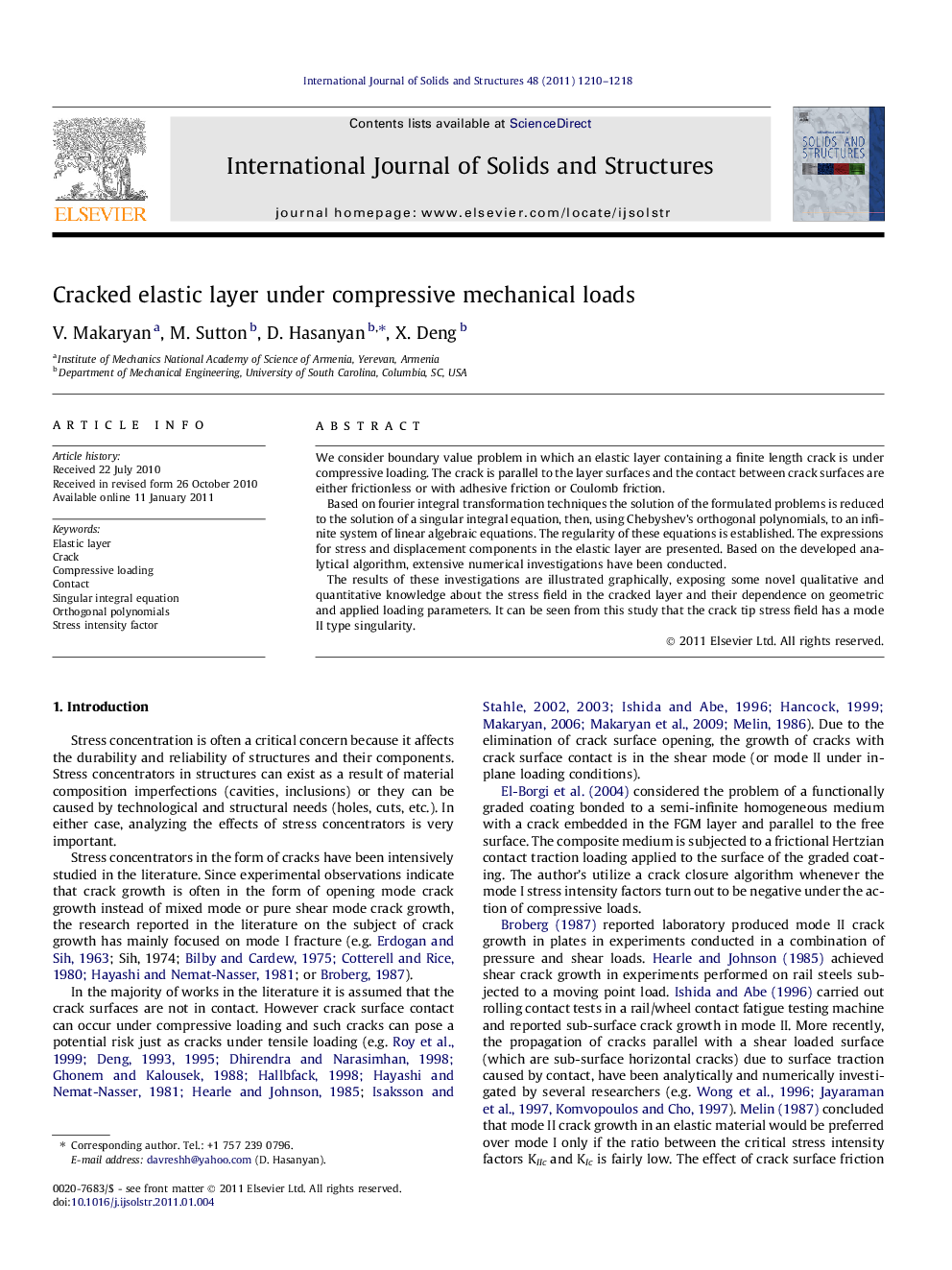 Cracked elastic layer under compressive mechanical loads