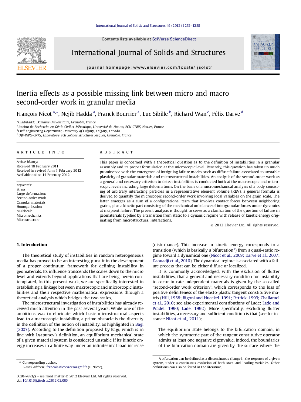 Inertia effects as a possible missing link between micro and macro second-order work in granular media