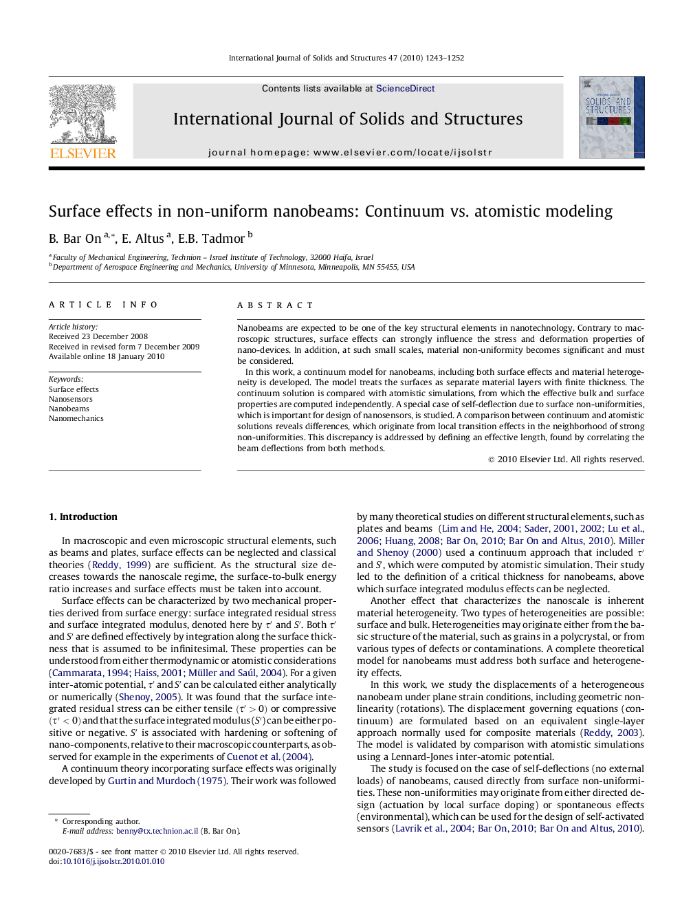 Surface effects in non-uniform nanobeams: Continuum vs. atomistic modeling