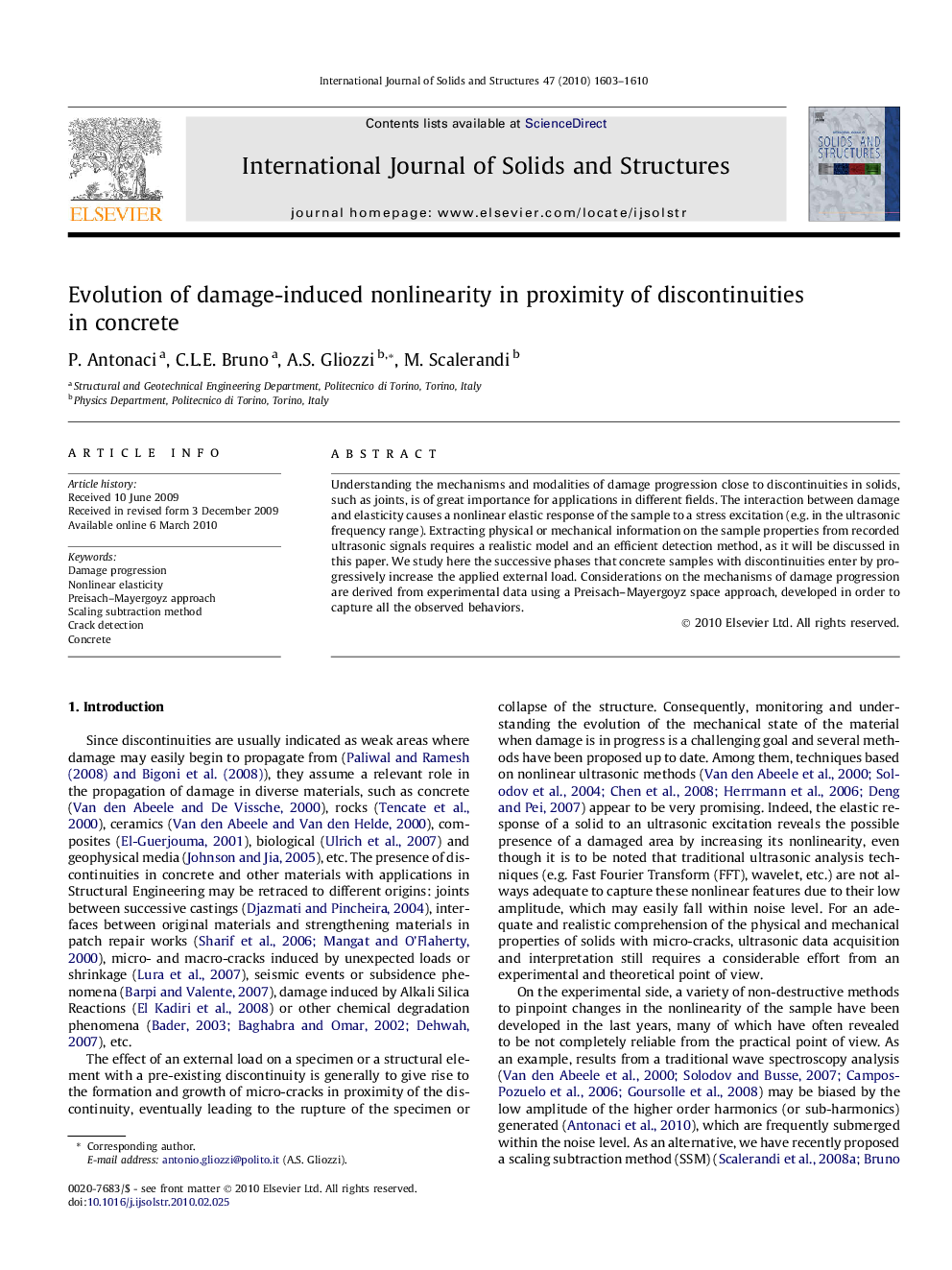 Evolution of damage-induced nonlinearity in proximity of discontinuities in concrete