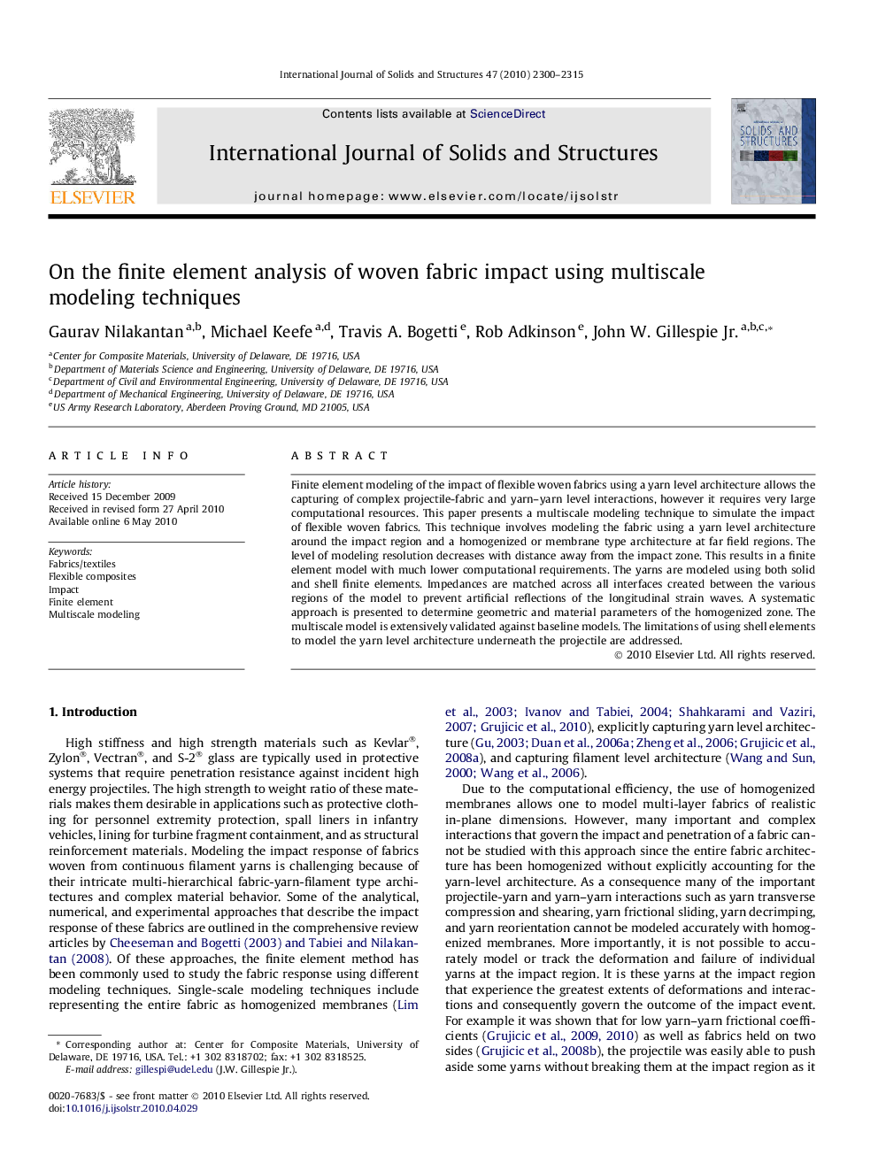 On the finite element analysis of woven fabric impact using multiscale modeling techniques