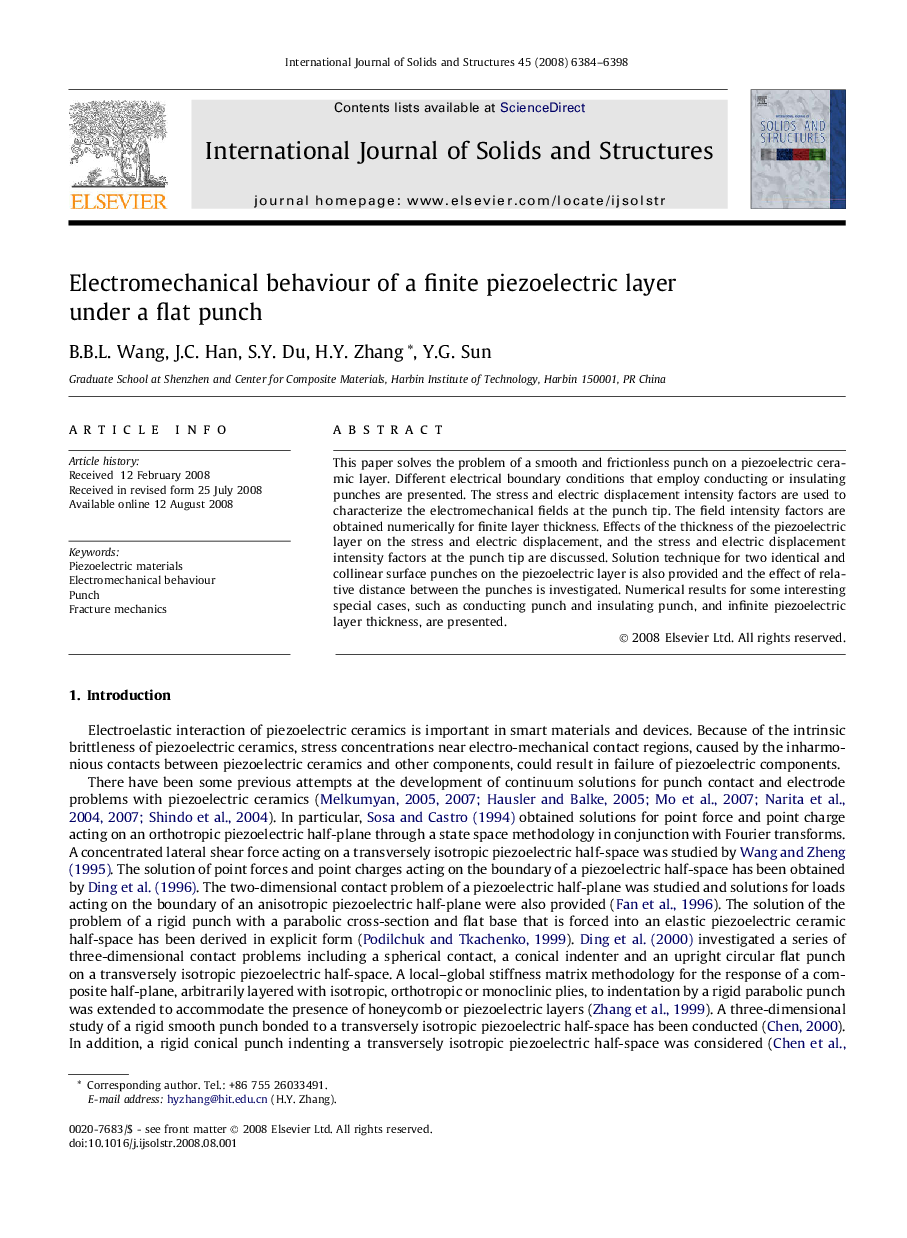 Electromechanical behaviour of a finite piezoelectric layer under a flat punch