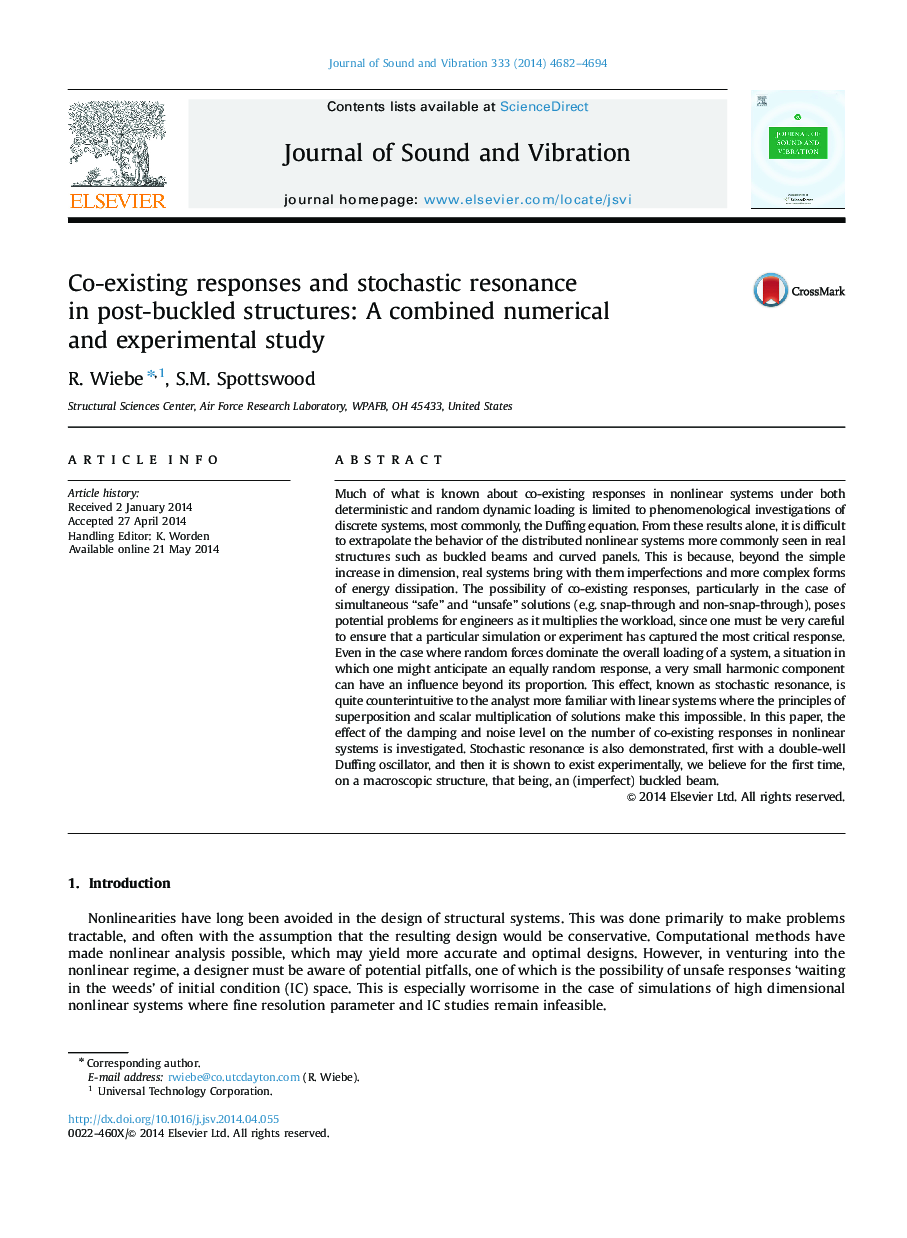 Co-existing responses and stochastic resonance in post-buckled structures: A combined numerical and experimental study