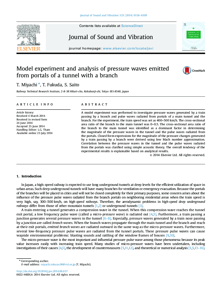 Model experiment and analysis of pressure waves emitted from portals of a tunnel with a branch