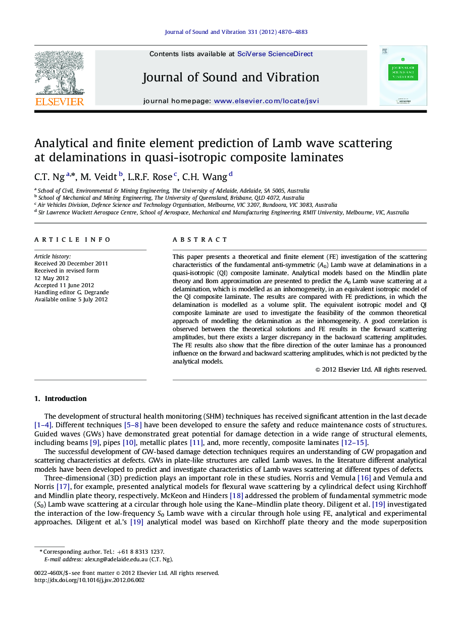Analytical and finite element prediction of Lamb wave scattering at delaminations in quasi-isotropic composite laminates