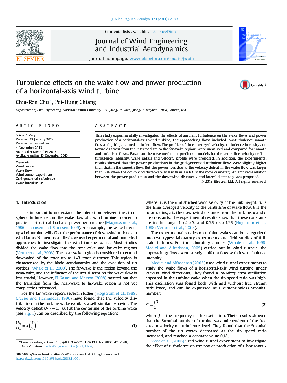 Turbulence effects on the wake flow and power production of a horizontal-axis wind turbine