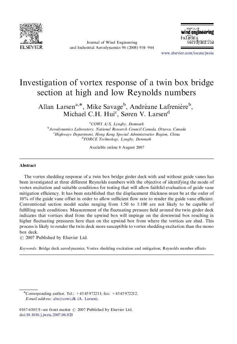 Investigation of vortex response of a twin box bridge section at high and low Reynolds numbers