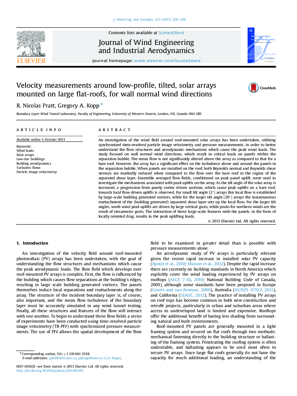 Velocity measurements around low-profile, tilted, solar arrays mounted on large flat-roofs, for wall normal wind directions