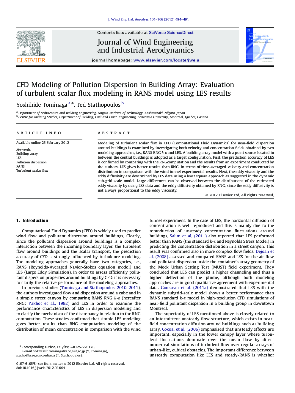 CFD Modeling of Pollution Dispersion in Building Array: Evaluation of turbulent scalar flux modeling in RANS model using LES results