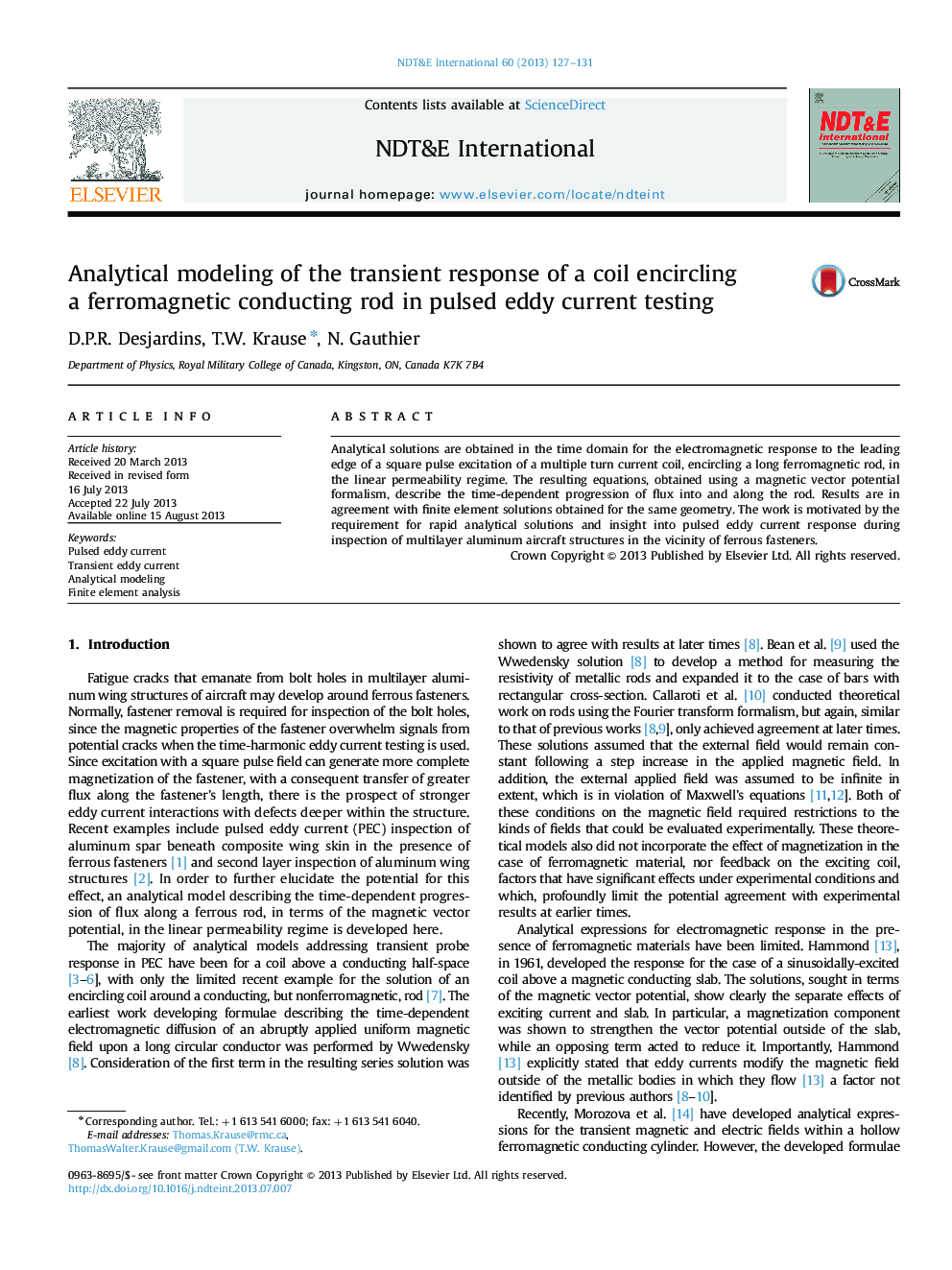 Analytical modeling of the transient response of a coil encircling a ferromagnetic conducting rod in pulsed eddy current testing