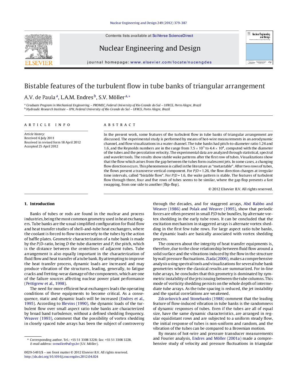 Bistable features of the turbulent flow in tube banks of triangular arrangement