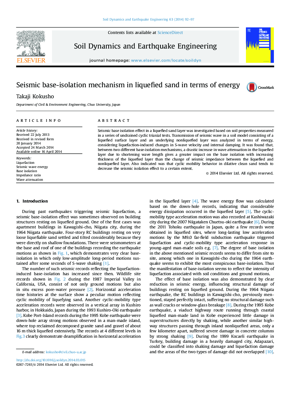 Seismic base-isolation mechanism in liquefied sand in terms of energy