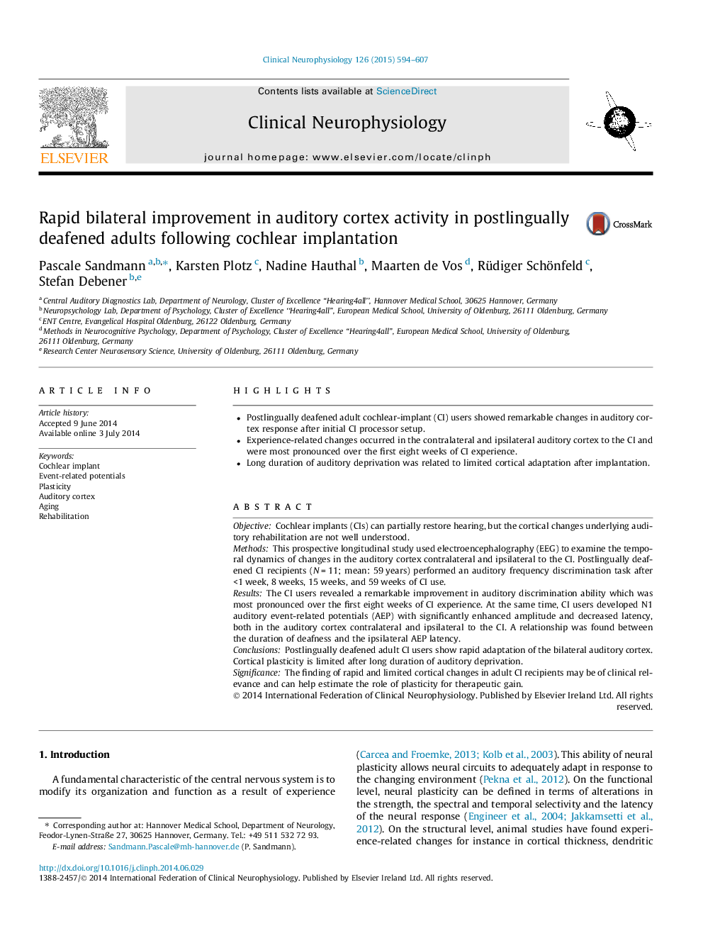 Rapid bilateral improvement in auditory cortex activity in postlingually deafened adults following cochlear implantation