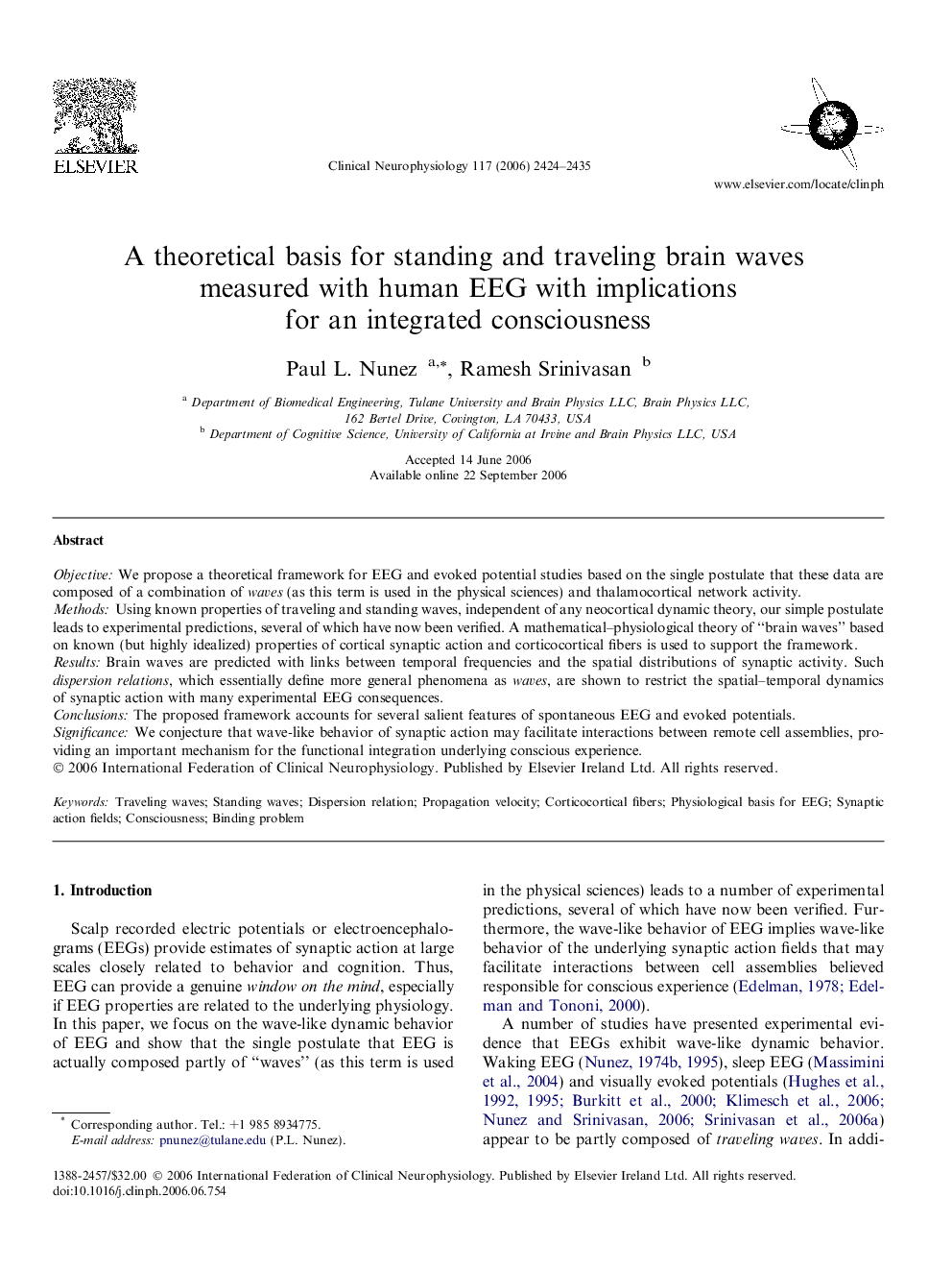 A theoretical basis for standing and traveling brain waves measured with human EEG with implications for an integrated consciousness