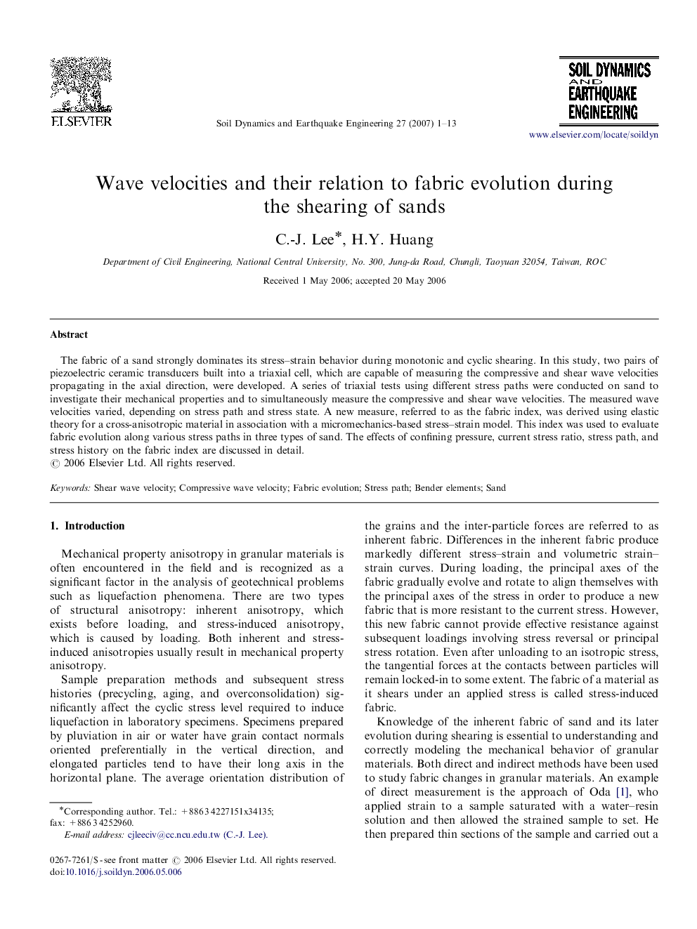 Wave velocities and their relation to fabric evolution during the shearing of sands