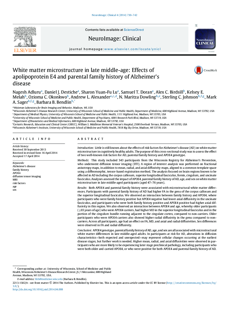 White matter microstructure in late middle-age: Effects of apolipoprotein E4 and parental family history of Alzheimer's disease