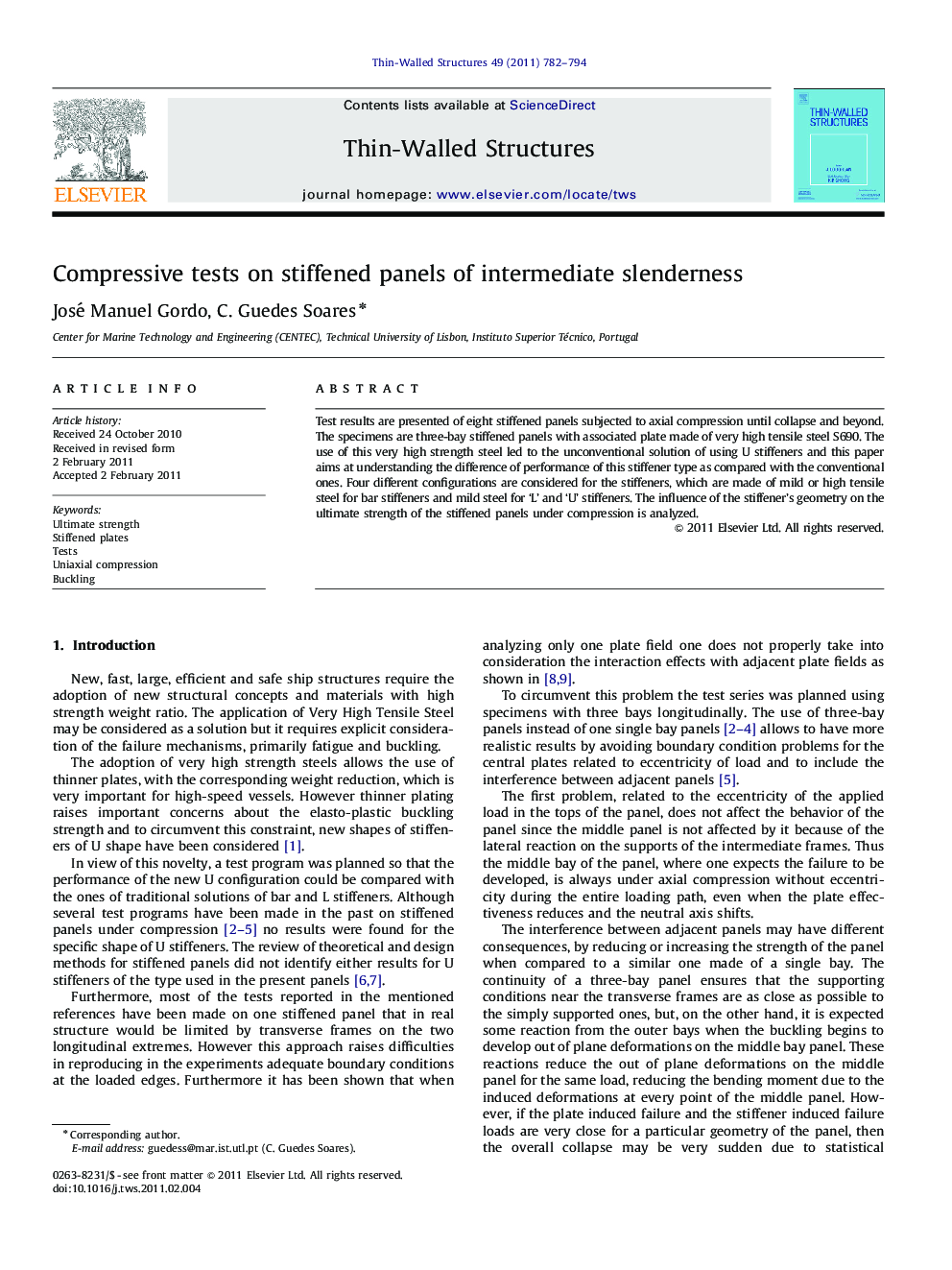 Compressive tests on stiffened panels of intermediate slenderness