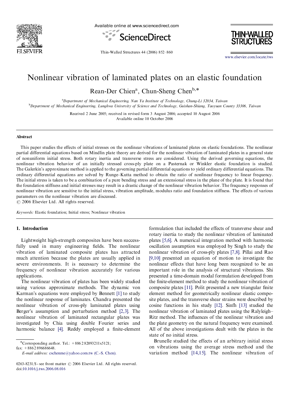 Nonlinear vibration of laminated plates on an elastic foundation