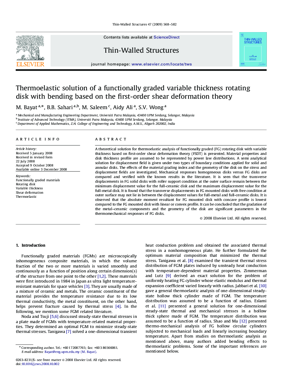 Thermoelastic solution of a functionally graded variable thickness rotating disk with bending based on the first-order shear deformation theory