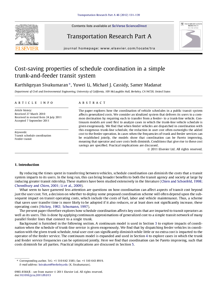 Cost-saving properties of schedule coordination in a simple trunk-and-feeder transit system