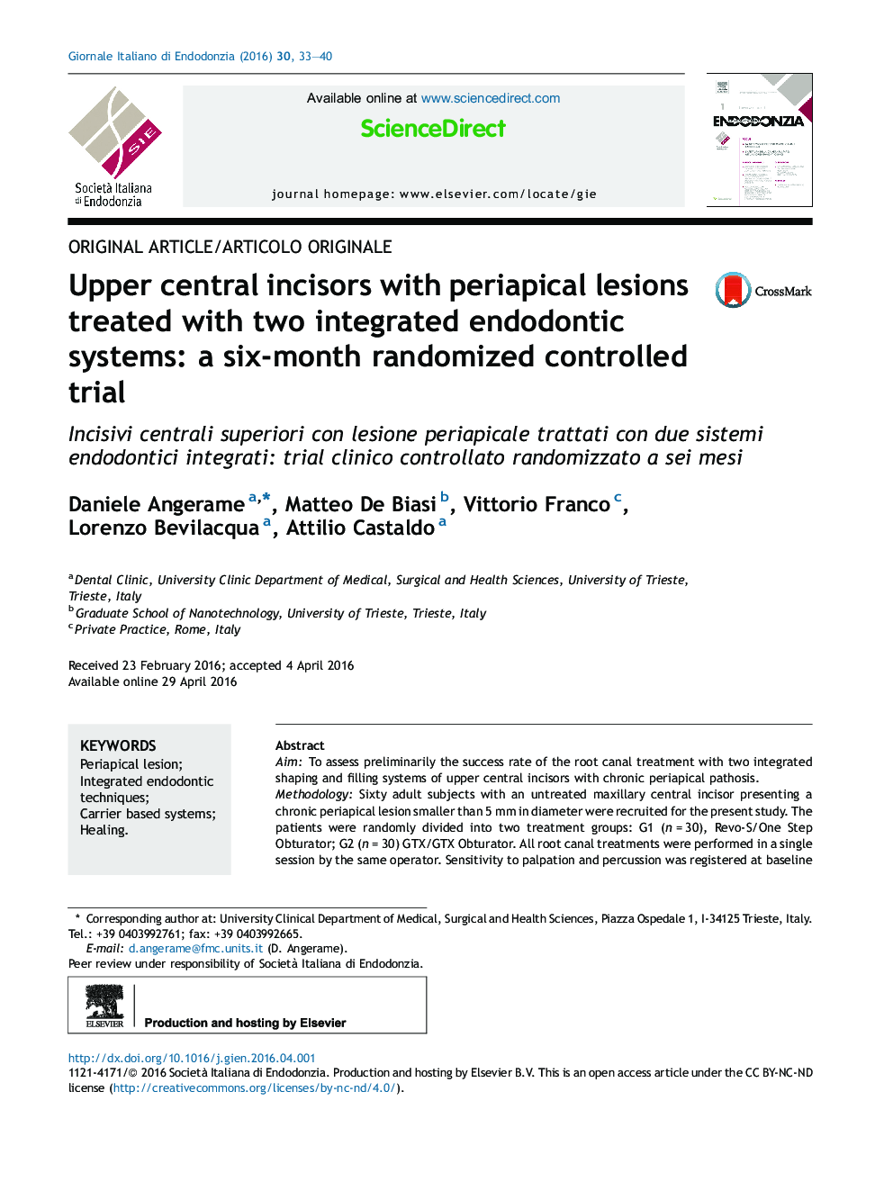 Upper central incisors with periapical lesions treated with two integrated endodontic systems: a six-month randomized controlled trial 