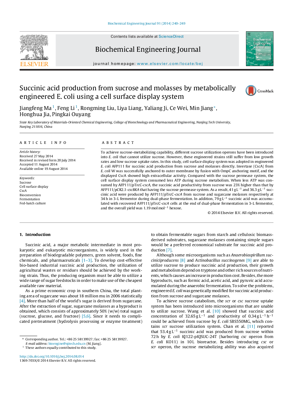 Succinic acid production from sucrose and molasses by metabolically engineered E. coli using a cell surface display system