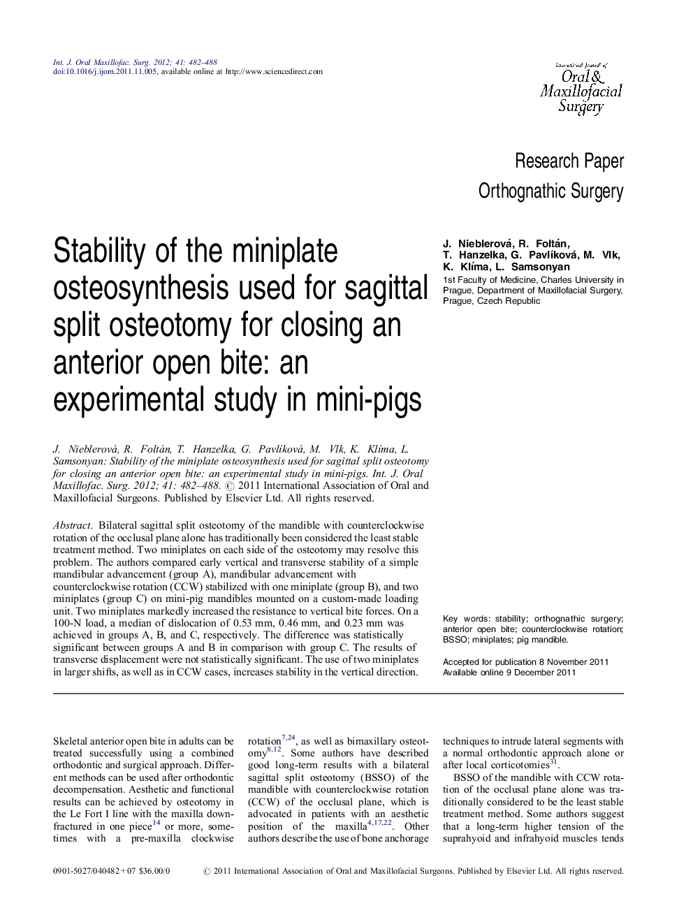 Stability of the miniplate osteosynthesis used for sagittal split osteotomy for closing an anterior open bite: an experimental study in mini-pigs