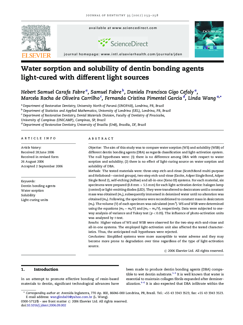 Water sorption and solubility of dentin bonding agents light-cured with different light sources