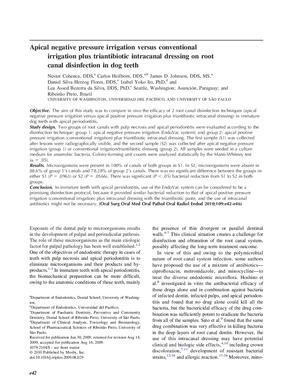 Apical negative pressure irrigation versus conventional irrigation plus triantibiotic intracanal dressing on root canal disinfection in dog teeth