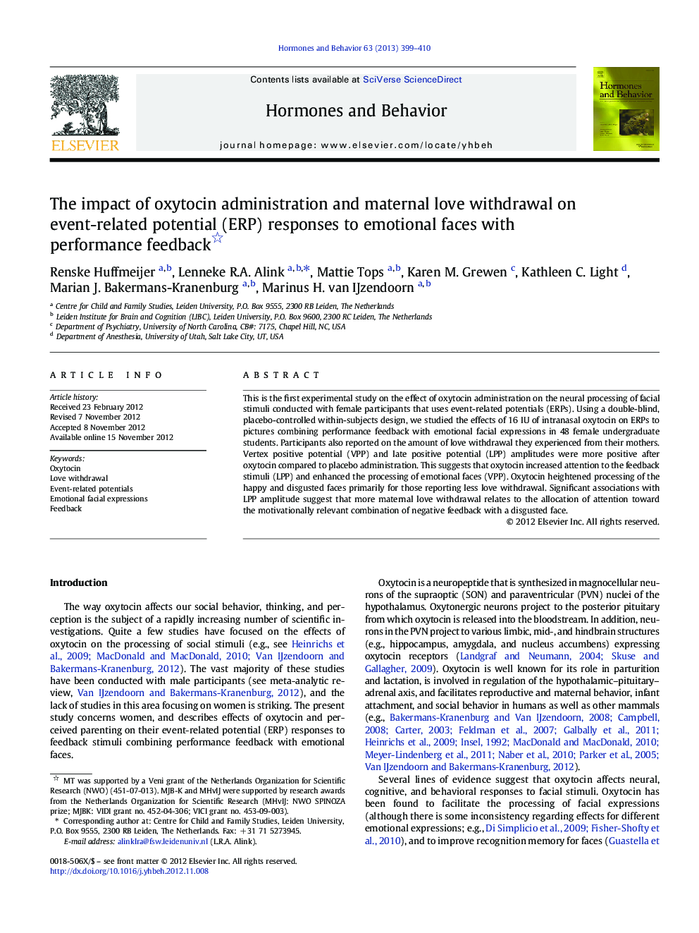 The impact of oxytocin administration and maternal love withdrawal on event-related potential (ERP) responses to emotional faces with performance feedback 